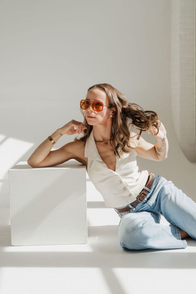 Natural light studio portrait of Roz Ackerman celebrating creative rediscovery in motherhood.